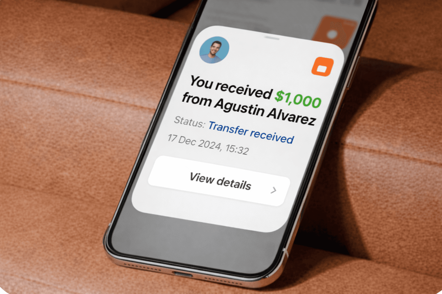 Transfer received notification on a phone screen.